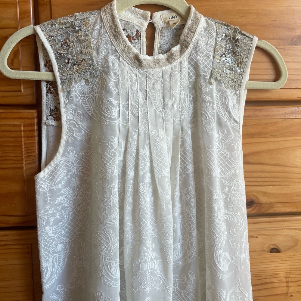 Elegant White Sleeveless Blouse with Sequin Details